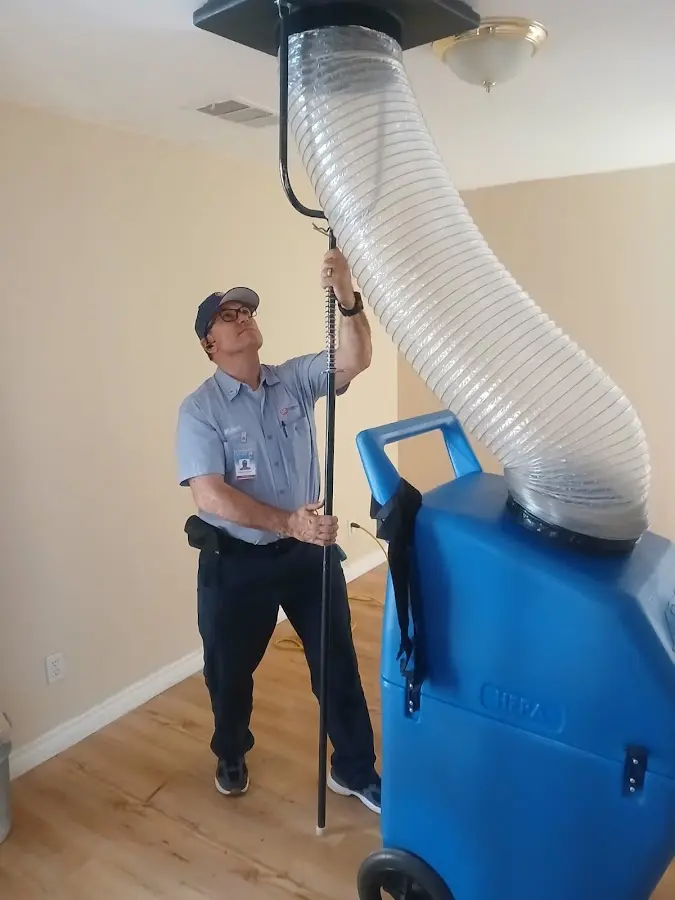 Furnace Tune-Up technician using HEPA equipment in North Laurel